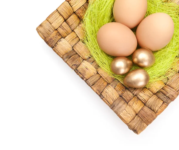 Easter eggs are on braided plate — Stock Photo, Image