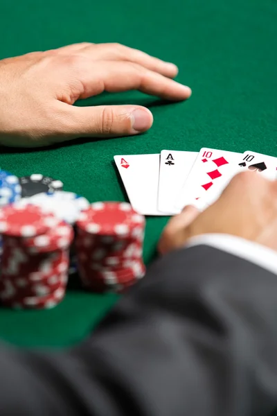 Poker player opens his cards — Stock Photo, Image