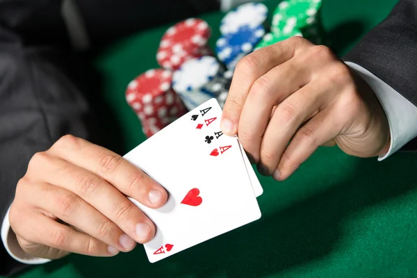 Gambler shows poker cards 4 aces — Stock Photo, Image