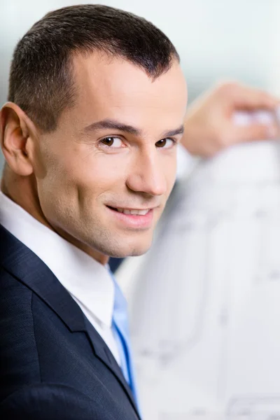 Close up of businessman with blueprint — Stock Photo, Image