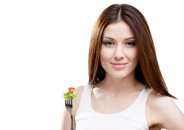 Woman eating fresh salad on a fork — Stock Photo, Image