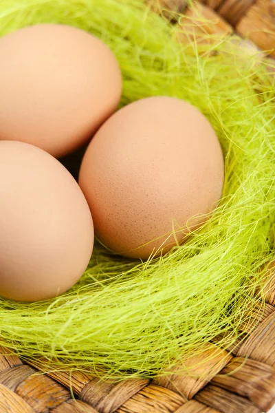 Easter eggs are on wattled plate, close up — Stock Photo, Image