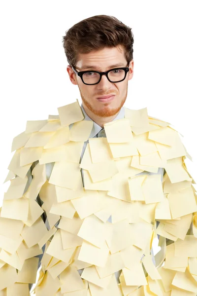 Joven triste con gafas cubiertas de notas amarillas pegajosas — Foto de Stock