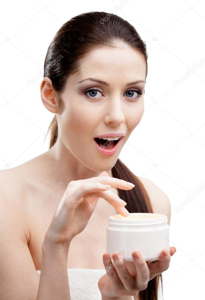 Woman starting to apply smoothing cream