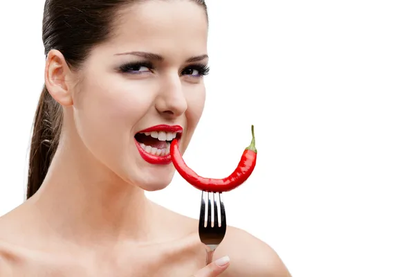 Woman with hot pepper on fork — Stock Photo, Image
