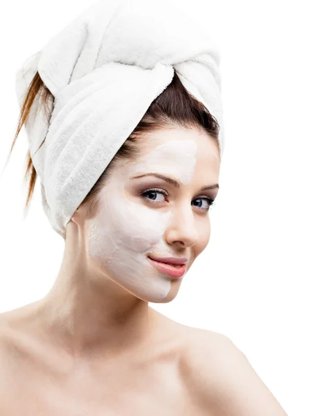 Woman with cream applied on a half of her face — Stock Photo, Image