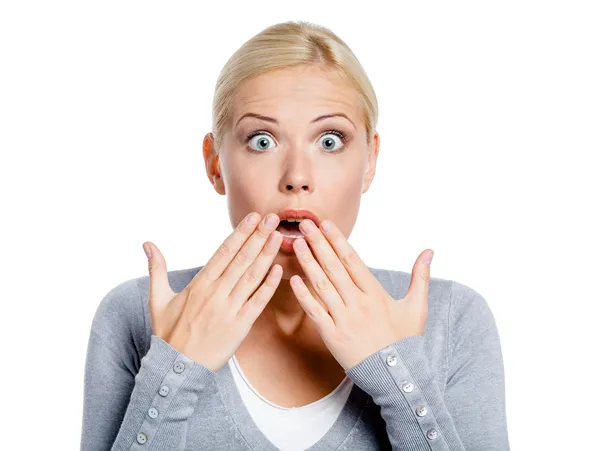 Shocked girl covers mouth with hands — Stock Photo, Image