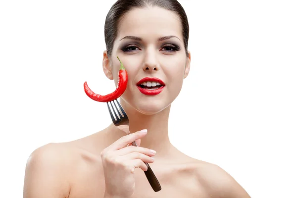 Woman with capsicum on fork — Stock Photo, Image