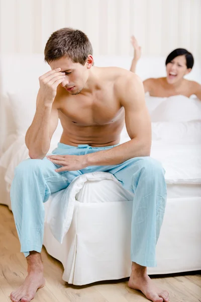 Young couple argues in bed — Stock Photo, Image