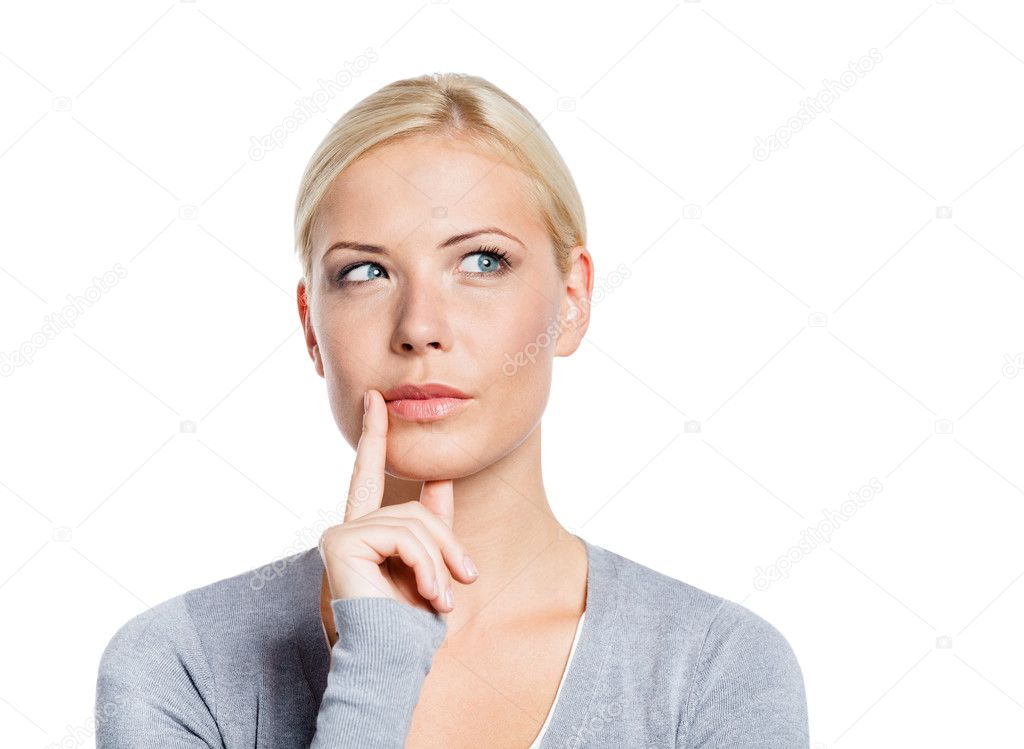 Pensive woman touching her face
