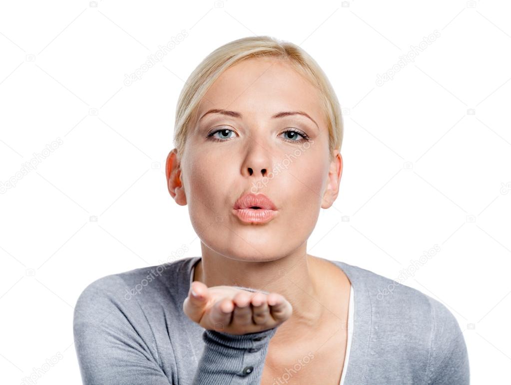 Woman blows a kiss to somebody