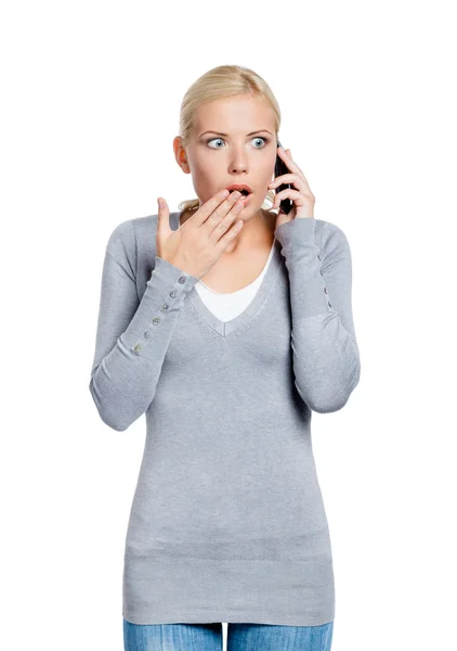 Speaking on phone shocked woman — Stock Photo, Image