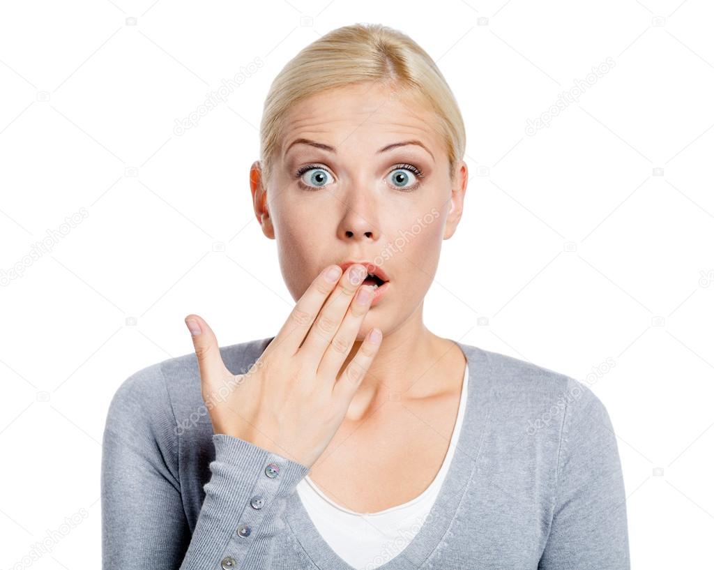 Shocked girl covers her mouth with hand