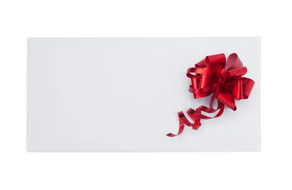 Tarjeta de Navidad con lazo rojo —  Fotos de Stock