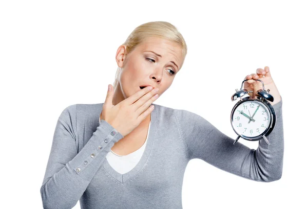 Yawning woman with alarm clock — Stock Photo, Image