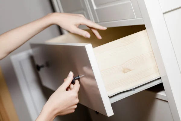 Close up of hand opening a drawer — Stock Photo, Image