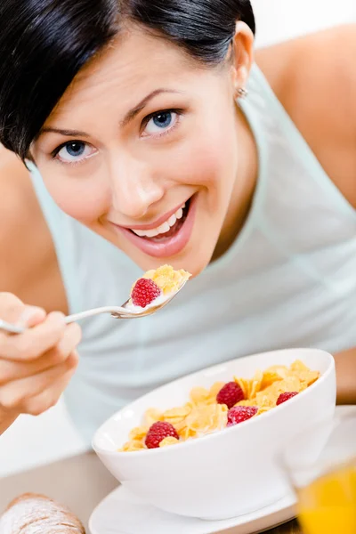 Girl eating tasty breakfast — Stock Photo, Image