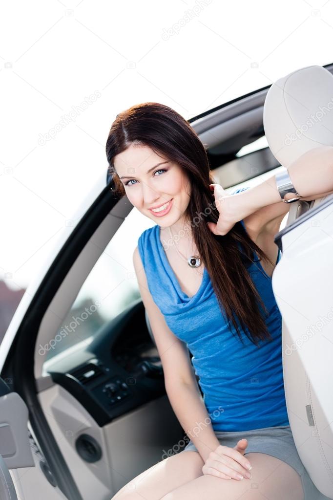 Close up of woman in the white car