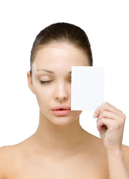 Naked girl hands copyspace card in front of her eye — Stock Photo, Image