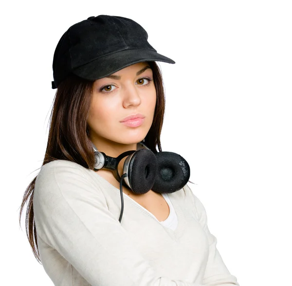 Teenager in peaked cap with earphones — Stock Photo, Image