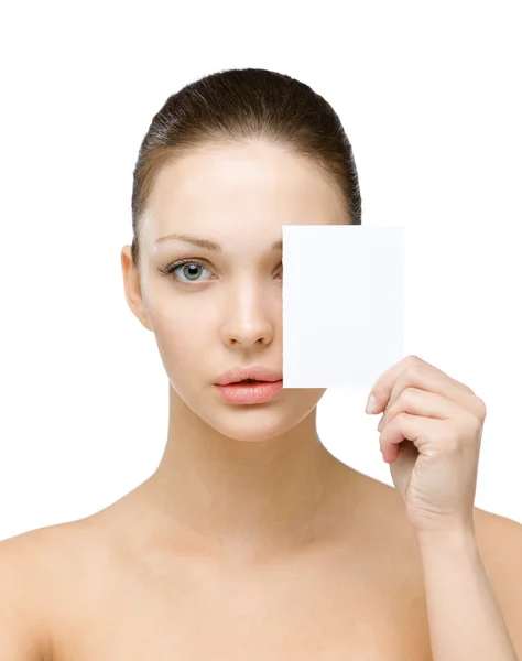 Nude girl hands copyspace card in front of her eye — Stock Photo, Image