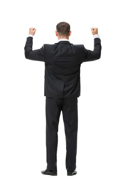 Полный обзор бизнесмена с поднятыми кулаками — стоковое фото