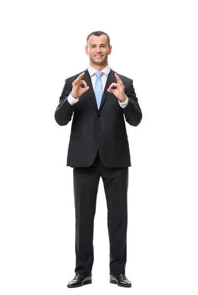 Full-length portrait of businessman ok gesturing — Stock Photo, Image