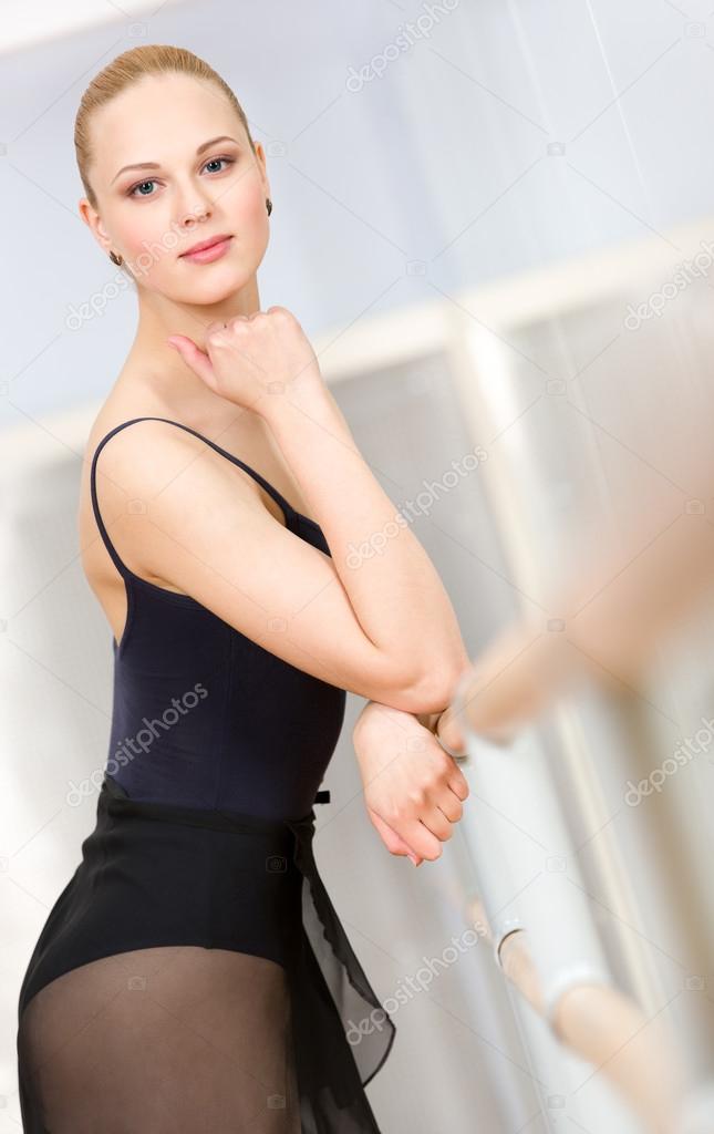 Portrait of standing near barre ballerina