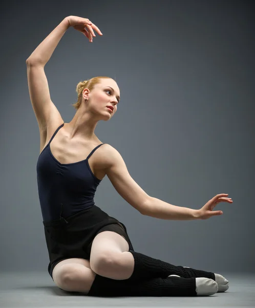 Dancing on the floor ballerina with her hand up — Stock Photo, Image