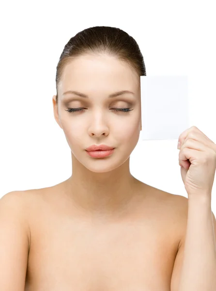 Naked girl hands copyspace card near her face — Stock Photo, Image