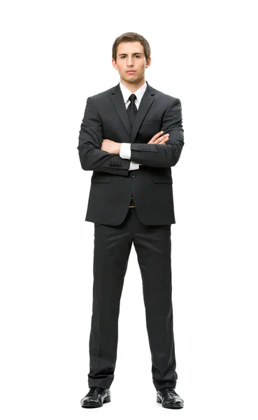 Full-length portrait of businessman with hands crossed — Stock Photo, Image