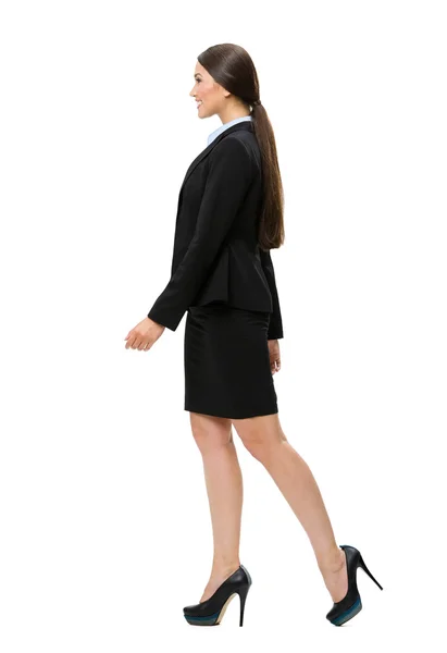 Full-length profile of walking business woman — Stock Photo, Image