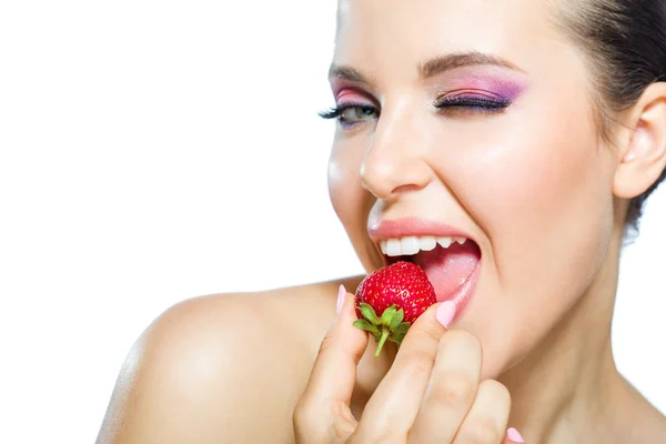 Close up of lady eating strawberry Royalty Free Stock Images