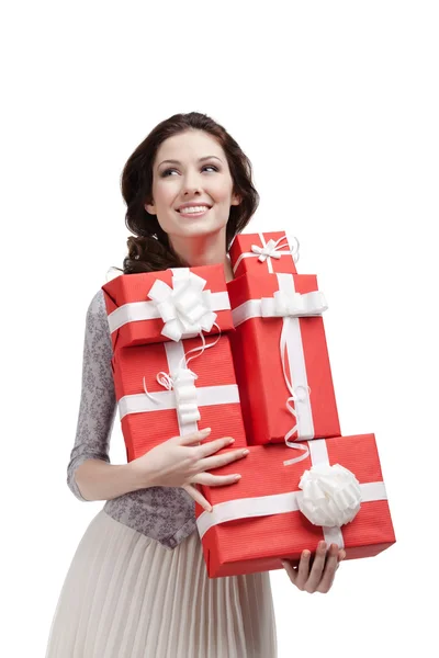 Mujer mantiene un número de cajas de regalo —  Fotos de Stock