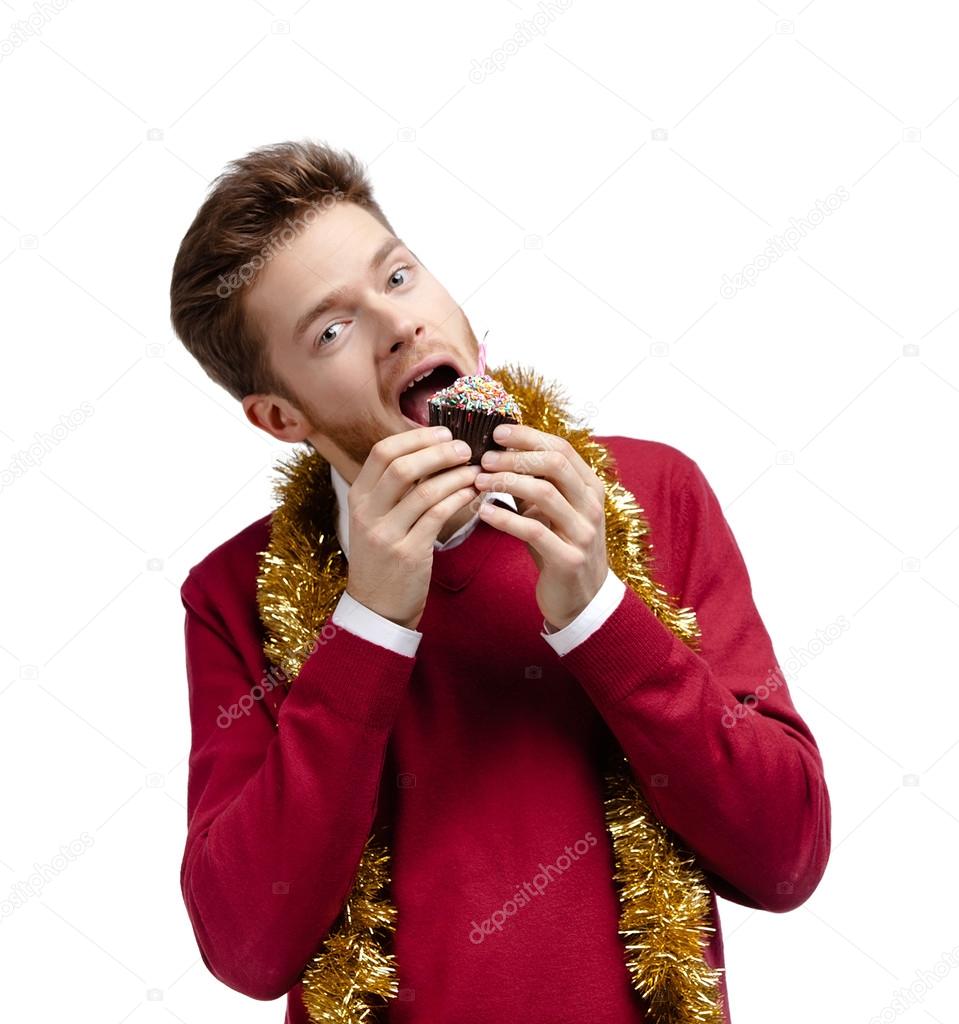 Man eats small cake