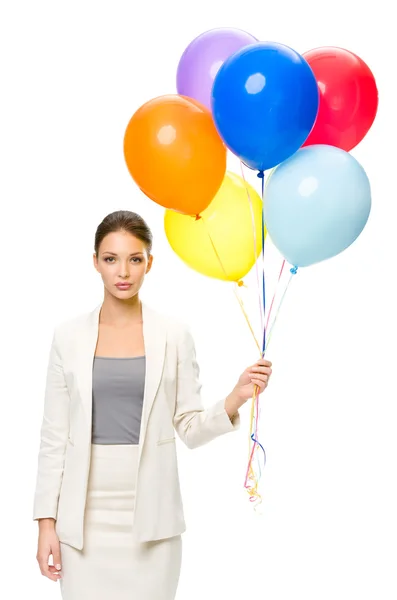 Businesswoman keeping colorful balloons — Stock Photo, Image