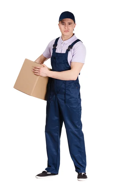 Workman in overalls hands a cardboard box — Stock Photo, Image