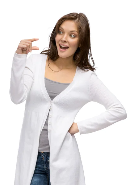 Young girl showing small amount of something — Stock Photo, Image