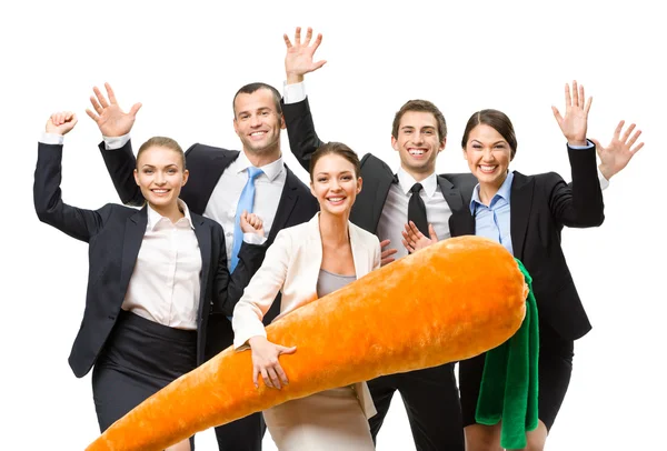 Business people with toy carrot — Stock Photo, Image