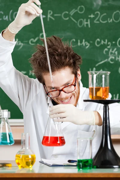 Mad professor conducts some chemical tests Stock Image