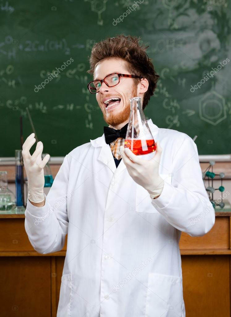 Mad professor laughs handing conical flask