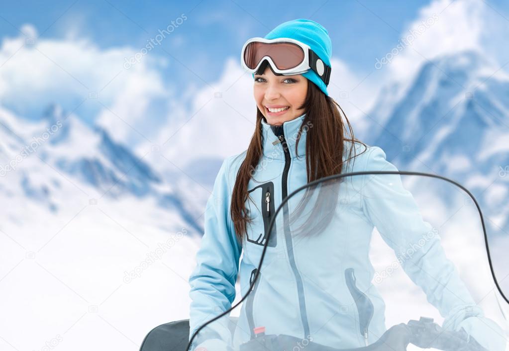 Portrait of woman on snowmobile