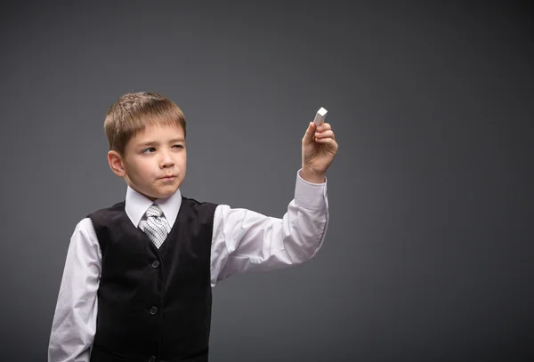 Portrait of boy writing — Stock Photo, Image