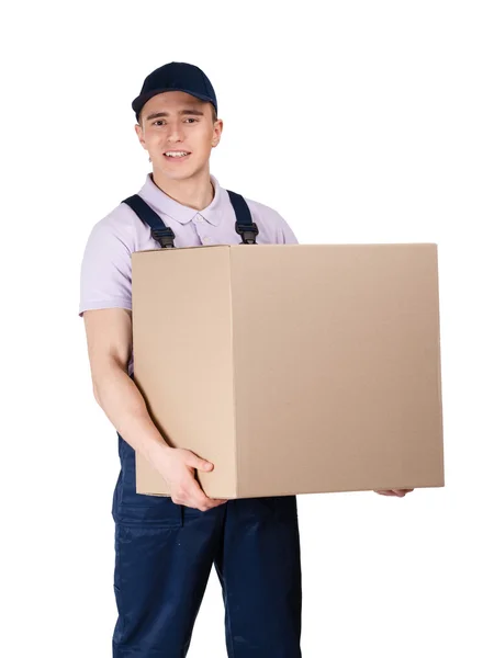 Workman in overalls hands a big parcel — Stock Photo, Image