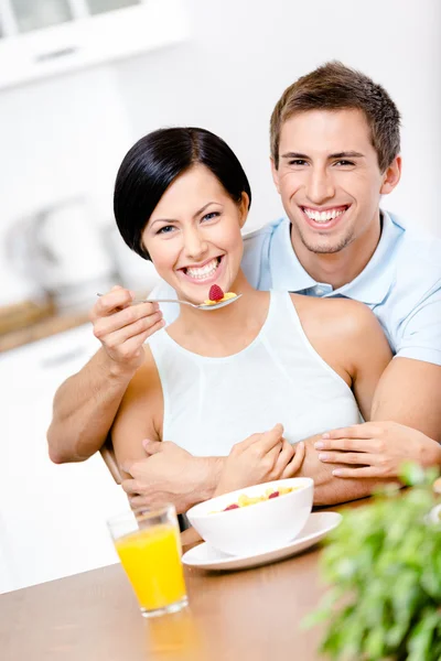 Male feeds and embraces his girlfriend — Stock Image Male feeds and embraces his girlfriend Royalty Free Stock Photos