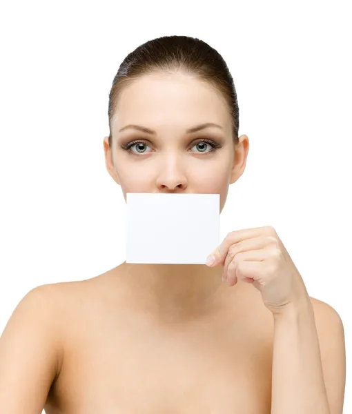 Naked girl hands copyspace card in front of her mouth — Stock Photo, Image