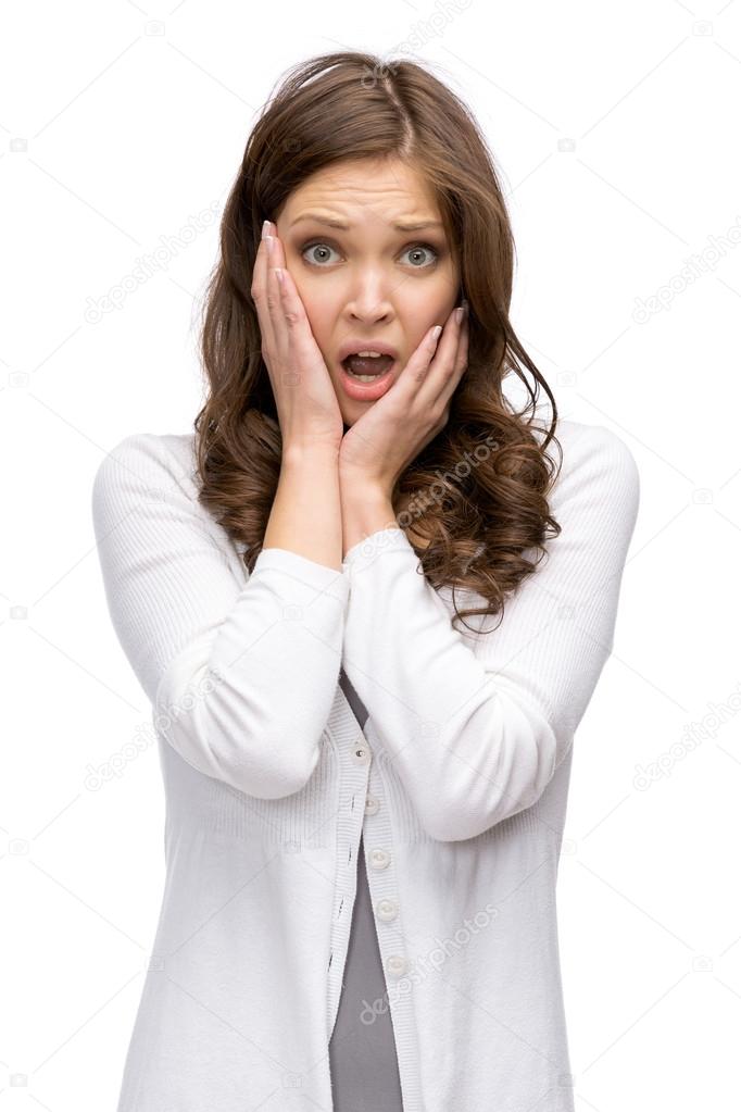 Shocked woman putting hands on head