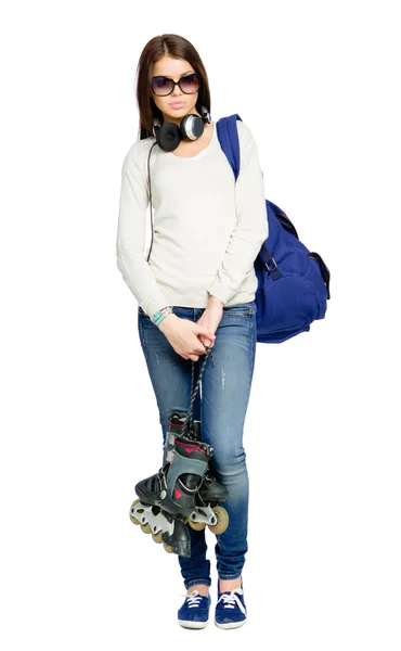 Teenager with roller skates, rucksack and earphones — Stock Photo, Image