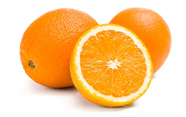 Close up of three oranges and one is cut — Stock Photo, Image