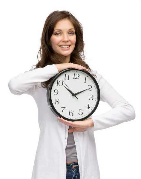 Woman handing clock — Stock Photo, Image